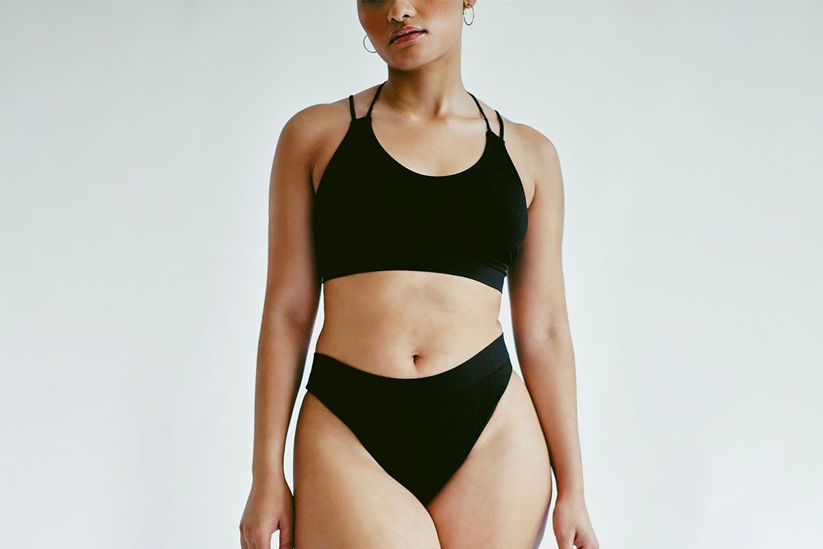 indianapolis tummy tuck model wearing earrings